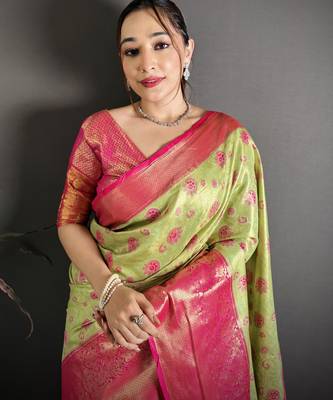 green kanjeevaram silk blend zari woven saree with unstitched blouse piece. 1