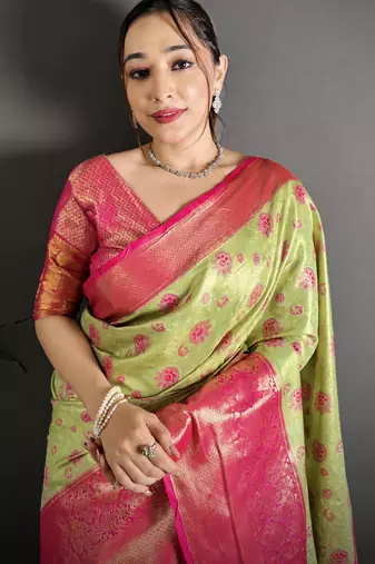 green kanjeevaram silk blend zari woven saree with unstitched blouse piece.