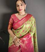 green kanjeevaram silk blend zari woven saree with unstitched blouse piece.