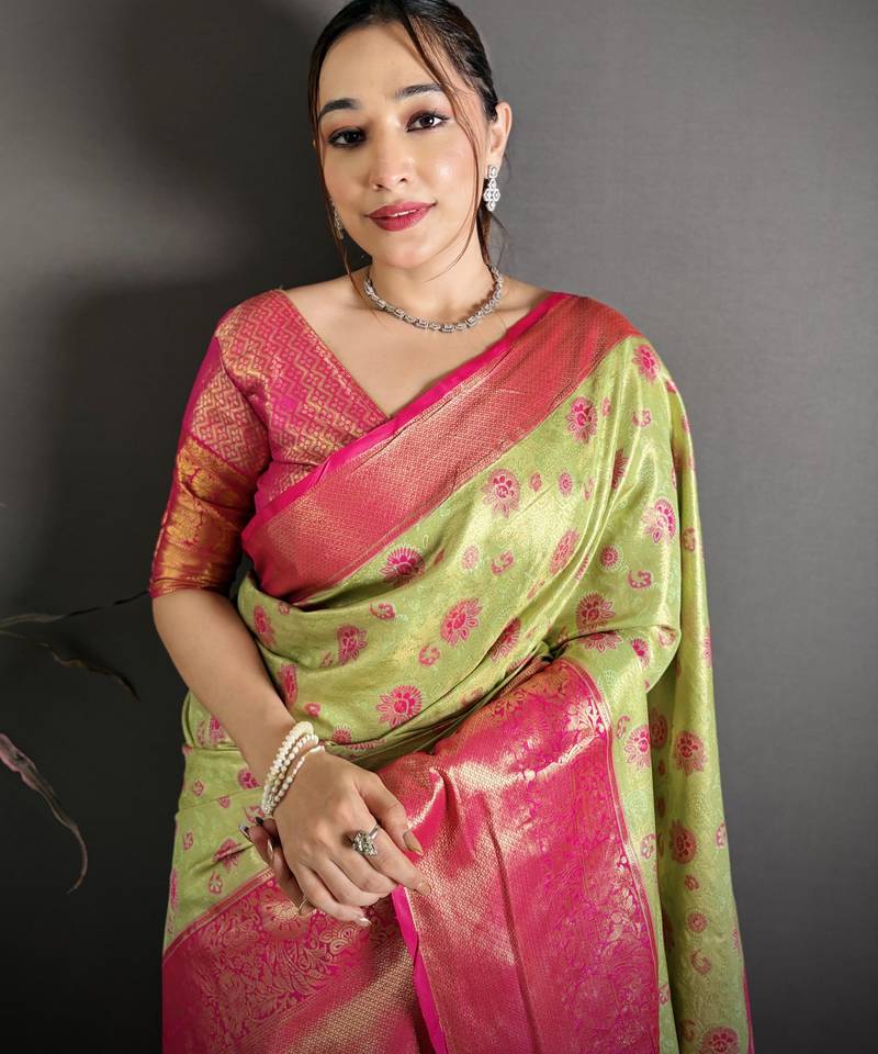 green kanjeevaram silk blend zari woven saree with unstitched blouse piece.