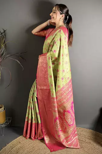 green kanjeevaram silk blend zari woven saree with unstitched blouse piece.