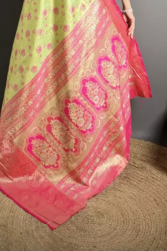 green kanjeevaram silk blend zari woven saree with unstitched blouse piece.
