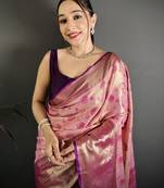 pink kanjeevaram silk blend zari woven saree with unstitched blouse piece.