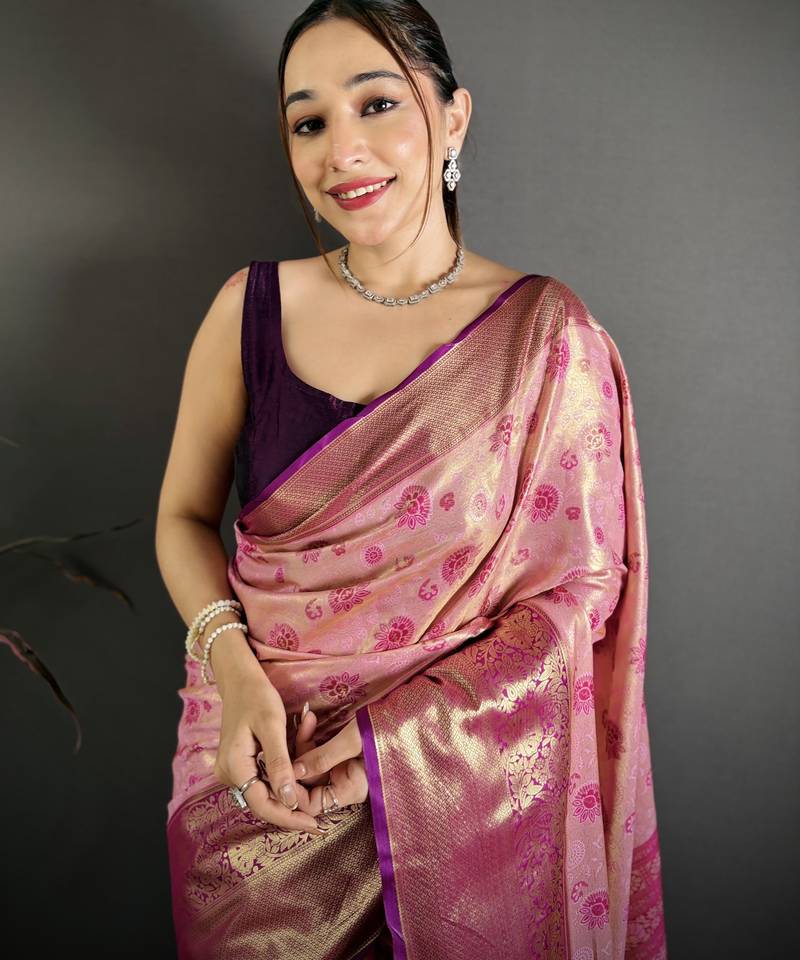 pink kanjeevaram silk blend zari woven saree with unstitched blouse piece.