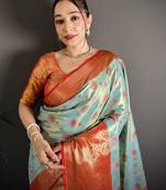 sky blue kanjeevaram silk blend zari woven saree with unstitched blouse piece.