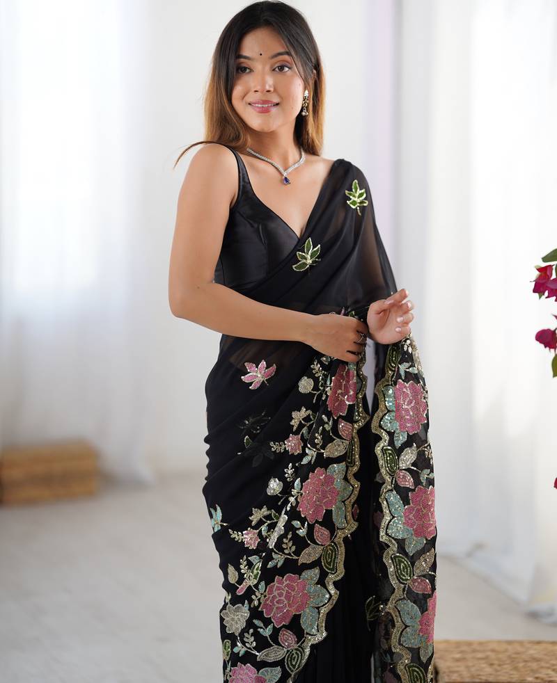 Black georgette sequins saree with unstitched blouse piece.