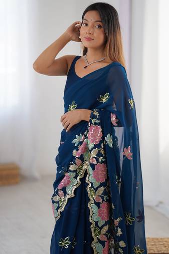 Teal georgette sequins saree with unstitched blouse piece.