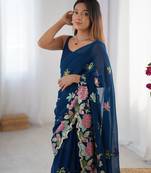Teal georgette sequins saree with unstitched blouse piece.