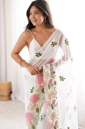 White georgette sequins saree with unstitched blouse piece.