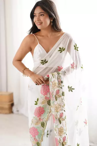 White georgette sequins saree with unstitched blouse piece.