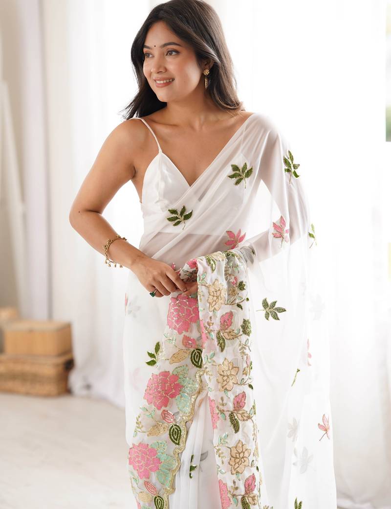 White georgette sequins saree with unstitched blouse piece.
