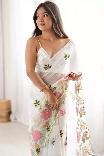 White georgette sequins saree with unstitched blouse piece.