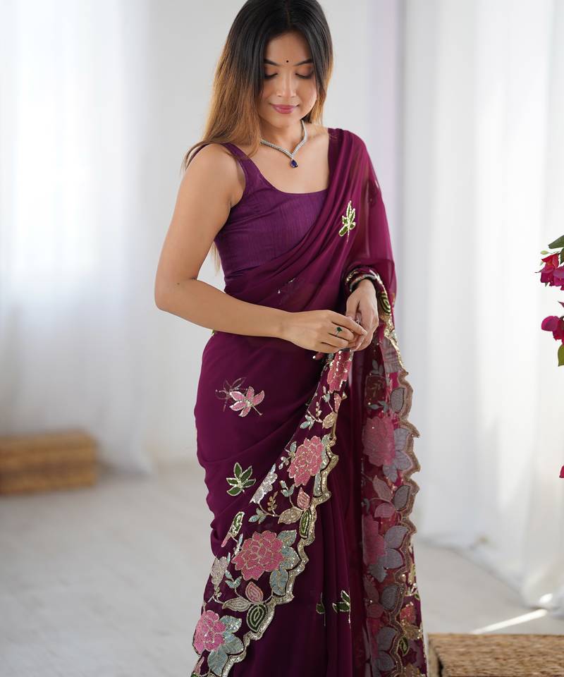 Wine georgette sequins saree with unstitched blouse piece.