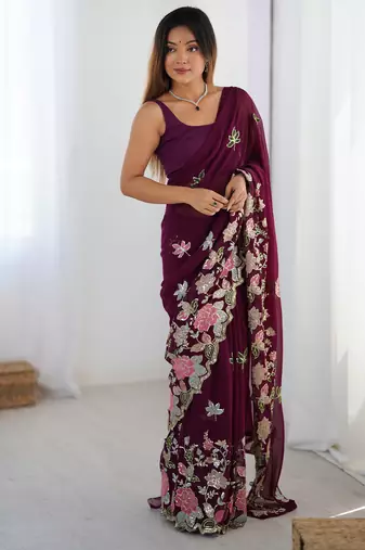 Wine georgette sequins saree with unstitched blouse piece.