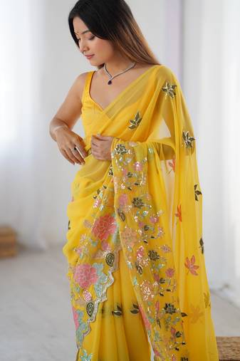 Yellow georgette sequins saree with unstitched blouse piece.