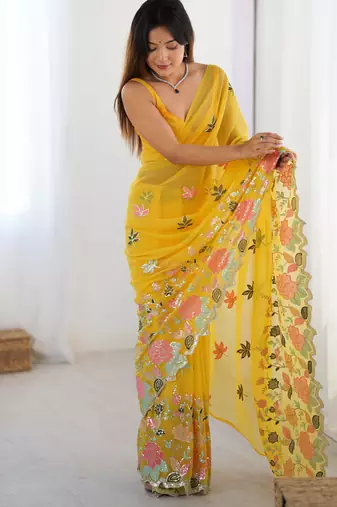 Yellow georgette sequins saree with unstitched blouse piece.