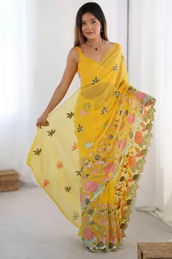 Yellow georgette sequins saree with unstitched blouse piece.