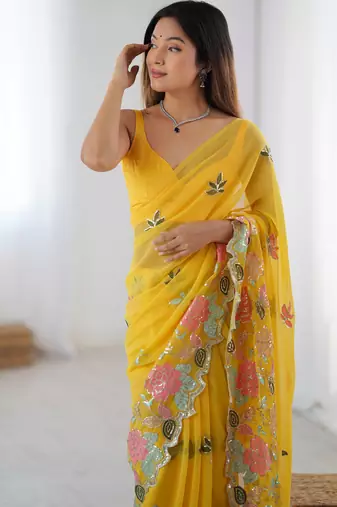 Yellow georgette sequins saree with unstitched blouse piece.