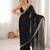 Black tissue satin embroidered saree with unstitched blouse piece.