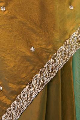 Gold tissue satin embroidered saree with unstitched blouse piece. 3