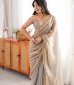 Grey tissue satin embroidered saree with unstitched blouse piece.