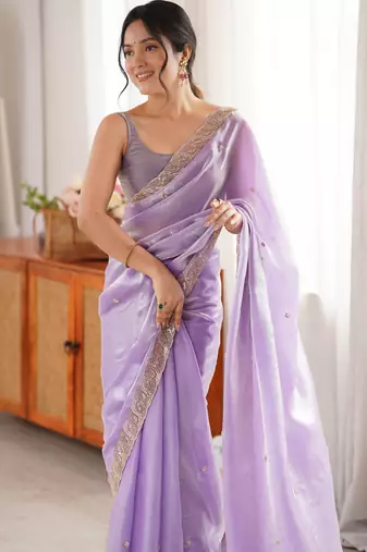 Lilac tissue satin embroidered saree with unstitched blouse piece.