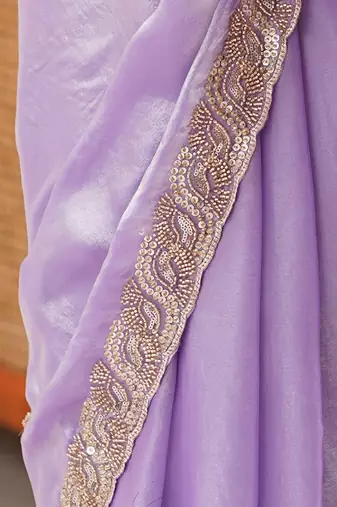 Lilac tissue satin embroidered saree with unstitched blouse piece.