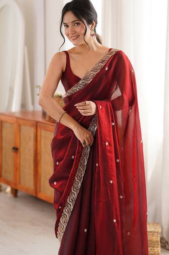 Maroon tissue satin embroidered saree with unstitched blouse piece.