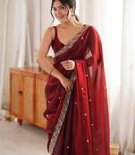 Maroon tissue satin embroidered saree with unstitched blouse piece.