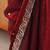 Maroon tissue satin embroidered saree with unstitched blouse piece.