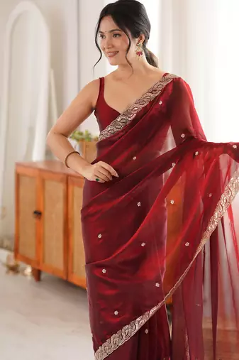 Maroon tissue satin embroidered saree with unstitched blouse piece.