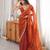 Orange tissue satin embroidered saree with unstitched blouse piece.