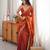 Orange tissue satin embroidered saree with unstitched blouse piece.
