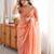 Peach tissue satin embroidered saree with unstitched blouse piece.