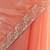 Peach tissue satin embroidered saree with unstitched blouse piece.