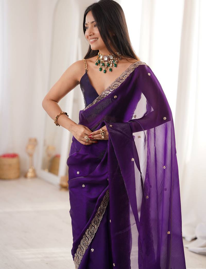 Purple tissue satin embroidered saree with unstitched blouse piece.
