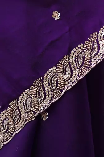 Purple tissue satin embroidered saree with unstitched blouse piece.