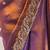 Rust tissue satin embroidered saree with unstitched blouse piece.