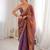 Rust tissue satin embroidered saree with unstitched blouse piece.