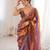 Rust tissue satin embroidered saree with unstitched blouse piece.