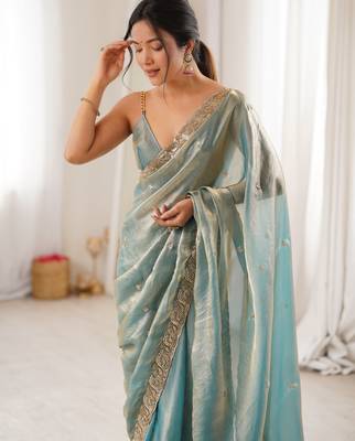 Sky blue tissue satin embroidered saree with unstitched blouse piece. 1
