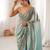 Sky blue tissue satin embroidered saree with unstitched blouse piece.