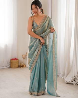 Sky blue tissue satin embroidered saree with unstitched blouse piece. 2