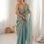 Sky blue tissue satin embroidered saree with unstitched blouse piece.