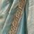 Sky blue tissue satin embroidered saree with unstitched blouse piece.