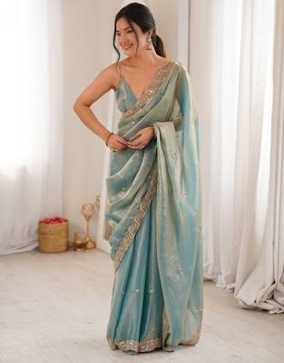 Sky blue tissue satin embroidered saree with unstitched blouse piece. 5