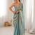 Sky blue tissue satin embroidered saree with unstitched blouse piece.