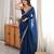 Teal tissue satin embroidered saree with unstitched blouse piece.