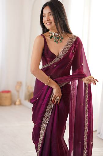 Wine tissue satin embroidered saree with unstitched blouse piece.