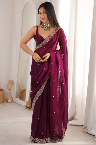 Wine tissue satin embroidered saree with unstitched blouse piece.